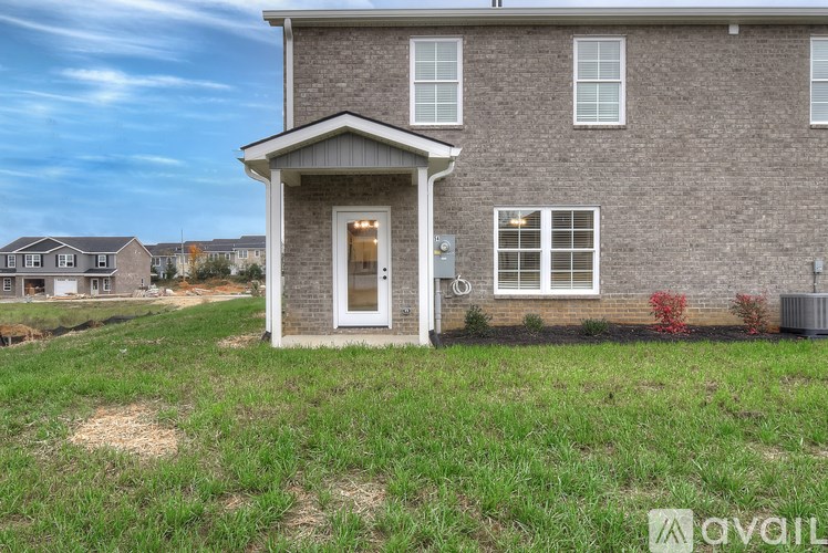 A house with a front yard and a sign that says "available".
