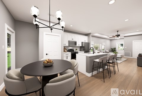 A modern kitchen with a dining table set for four.
