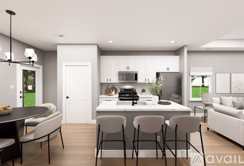 A modern kitchen with a dining table and chairs.