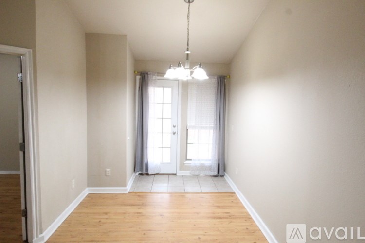 A room with a door and a window.