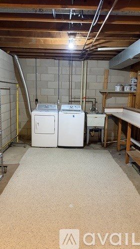 A room with a washer and dryer in it.