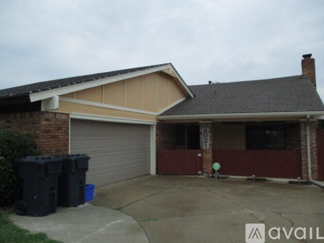 A house with a garage and a driveway.