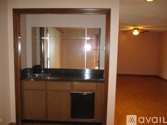 A kitchen with a sink and a window.