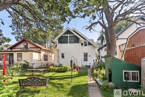 A green house is on the right side of the image.