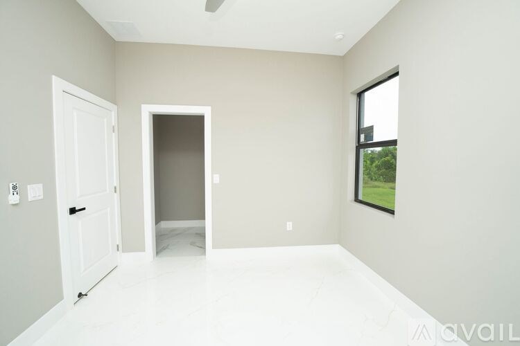 A room with a door and a window.