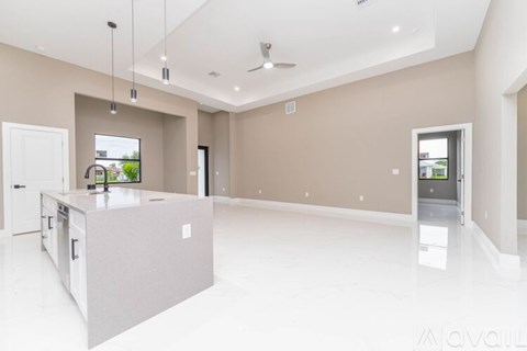 A spacious kitchen with a large island in the middle.