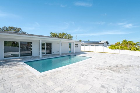 A modern house with a pool in the backyard.