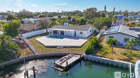 A house with a dock in front of it.