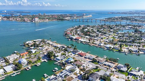 A coastal city with a bridge in the background.
