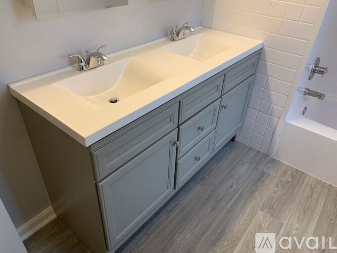 A bathroom with a sink and a tub.