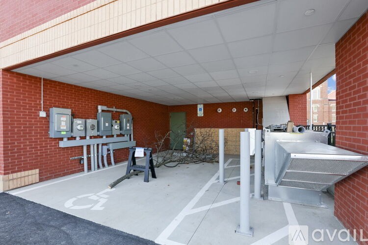 A parking garage with a white painted symbol on the ground.