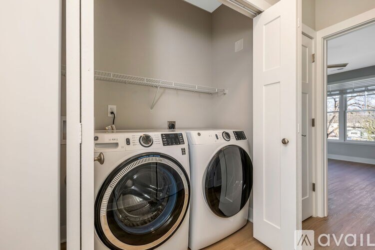 A laundry room with a washer and dryer.