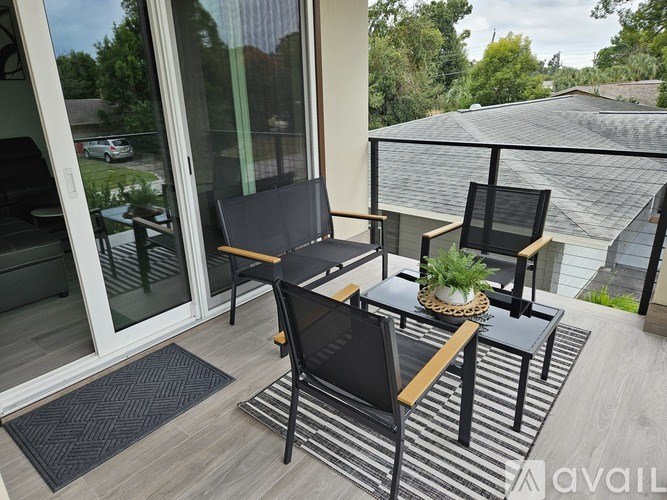 A patio with a table and chairs.