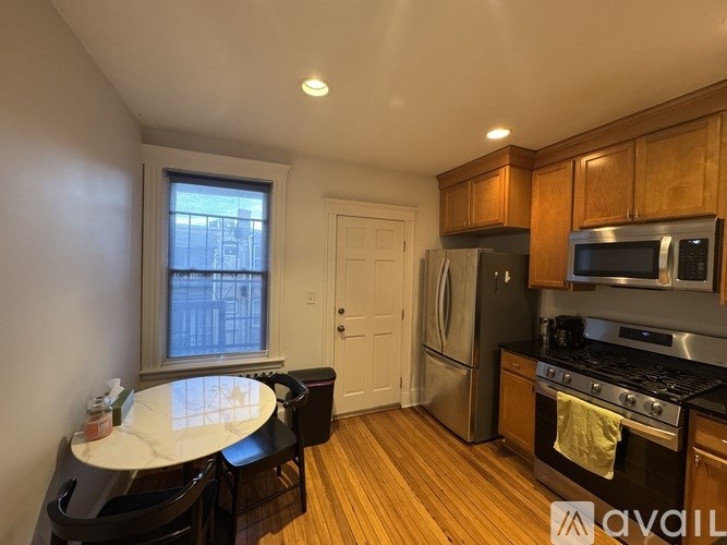 A kitchen with a stove top oven and microwave.
