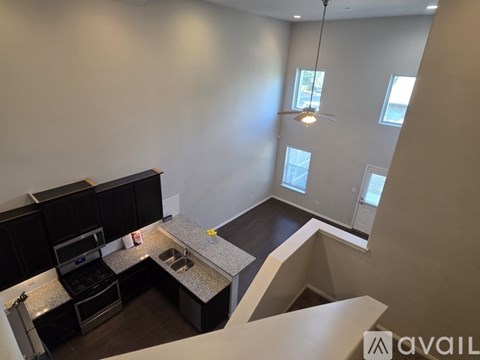 A kitchen with a sink and stove top oven.