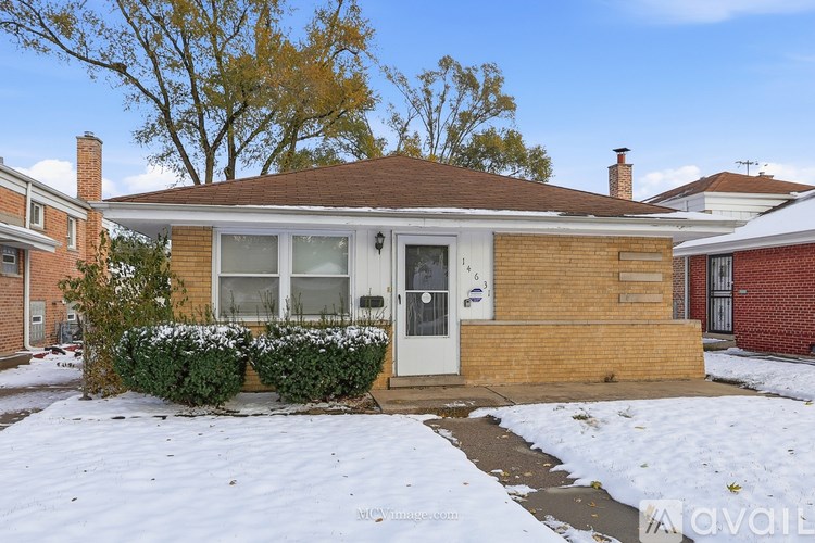 A house with a white door and a small front yard.
