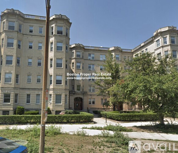 A building with the text "Boston Proper Real Estate" on it.