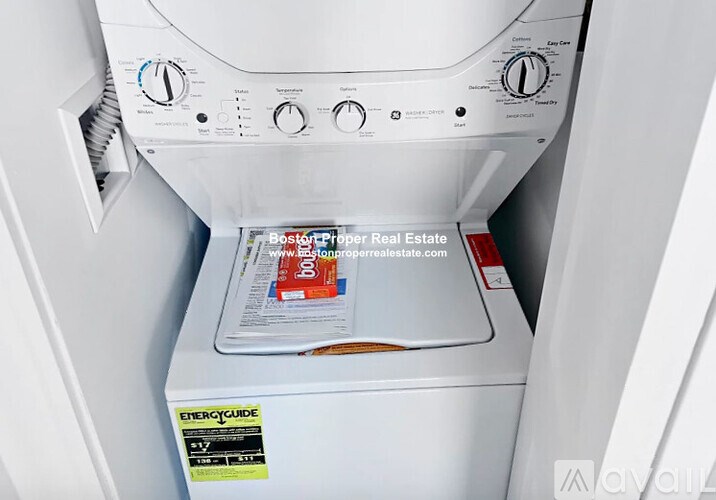 A white dryer with a sticker that says EnergyGuide.