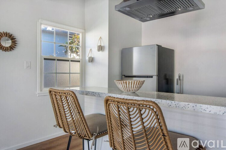 Two chairs are placed in front of a counter.