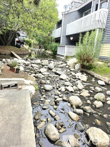 A stream of water with rocks in it.
