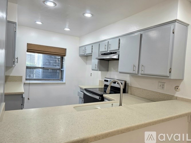 A kitchen with a countertop and cabinets.