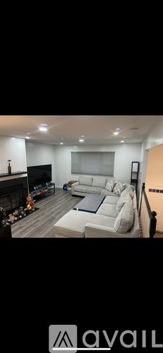 A living room with a fireplace and a couch.