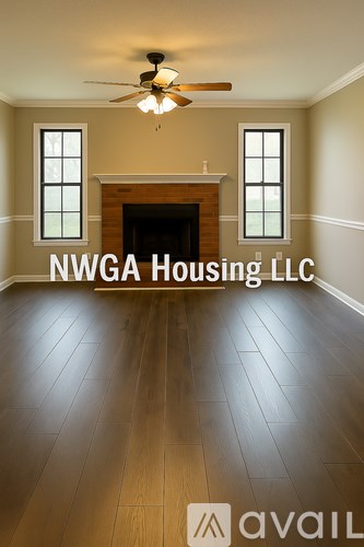 A room with a fireplace and a ceiling fan.