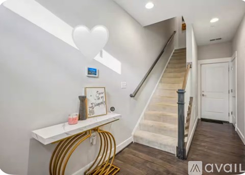 A staircase with a white wall and a sign that says "Sunshine Displays".