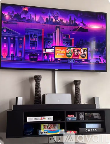 A television screen displays an advertisement for Candlelite Varnish.