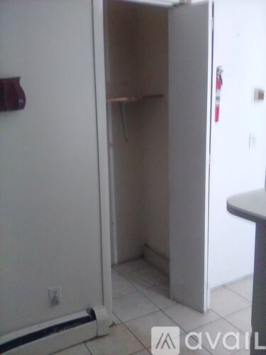 A white refrigerator with its door open in a kitchen.