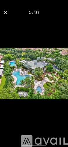 A bird's eye view of a luxurious resort with a swimming pool.