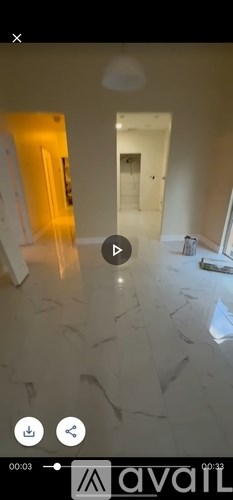 A room with a white floor and a white ceiling with a light fixture.