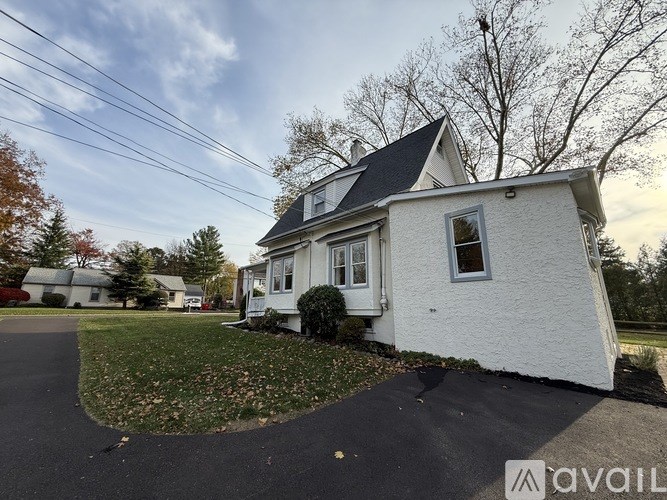 A house with a driveway in front of it.