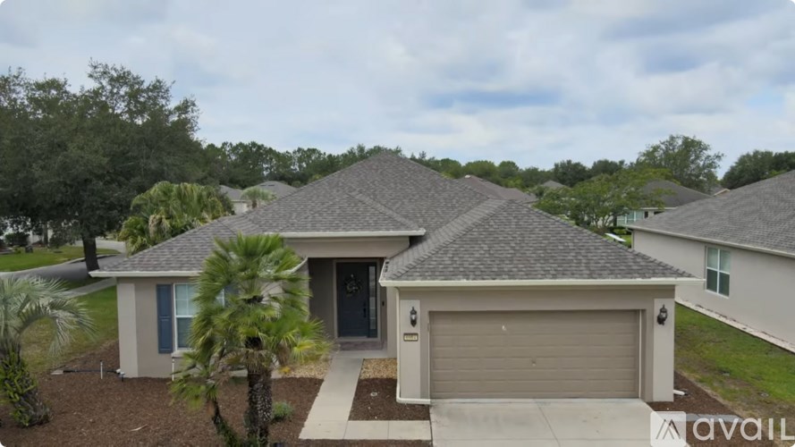 A house with a garage is for sale.