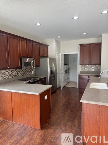 A kitchen with wooden cabinets and a countertop.