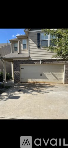 A house with a closed garage door.