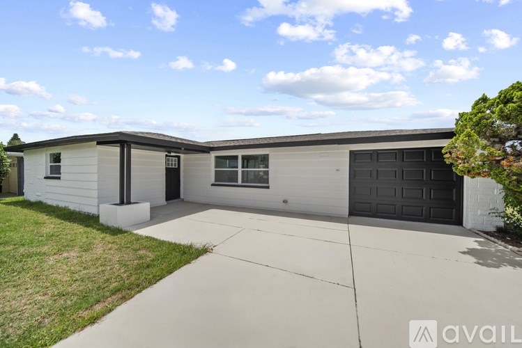 A two-story house with a garage is available for rent.