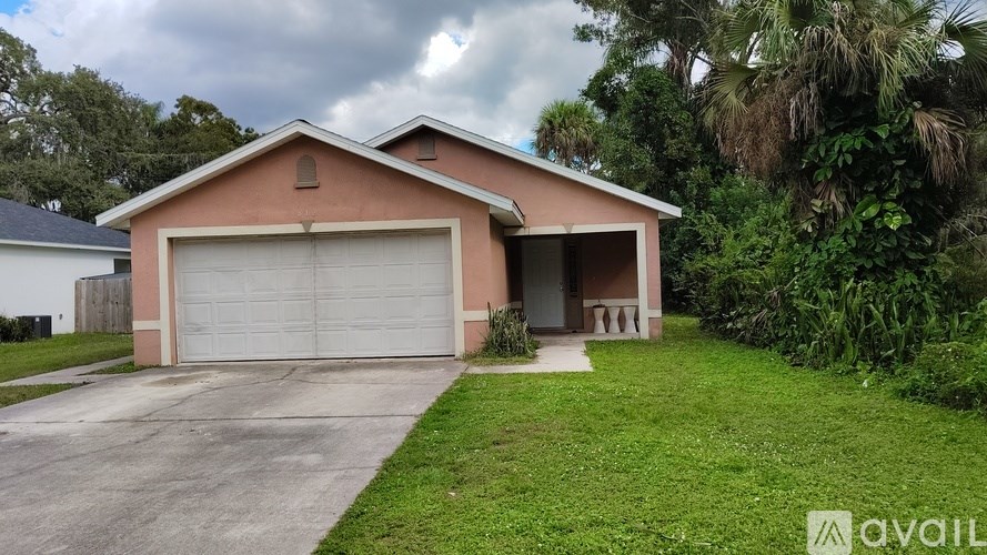 A house with a garage is for sale.