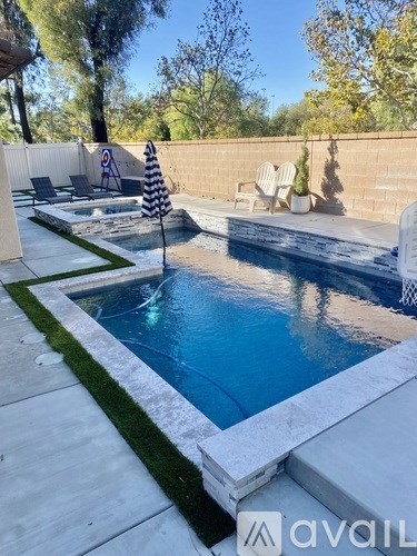 A pool with a striped flag in the middle of it.
