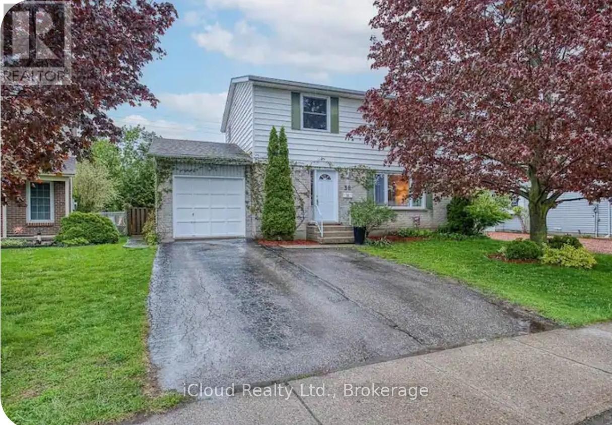A house with a white garage door is for sale.