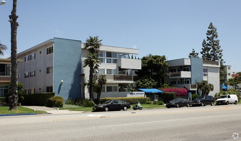 A modern building with a blue tinted glass facade.
