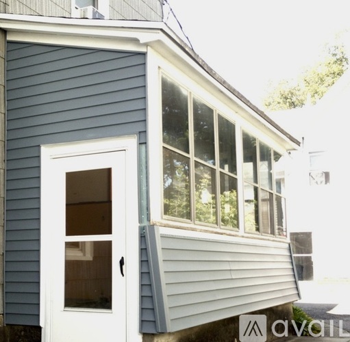 A house with a white door and a window.