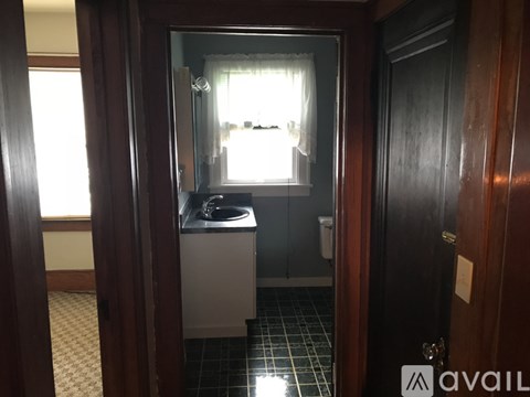 A bathroom with a sink and a mirror.