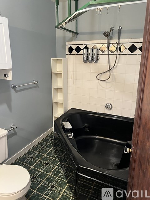 A kitchen with brown cabinets and a white fridge.
