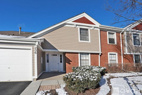 A house with a garage and a driveway.