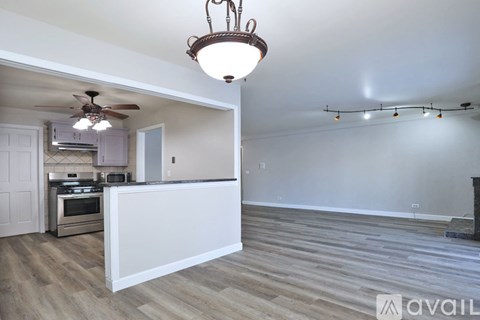 A kitchen with a fan and a countertop.