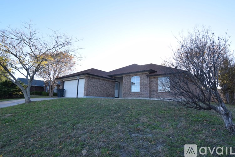 A house with a tree in front of it.