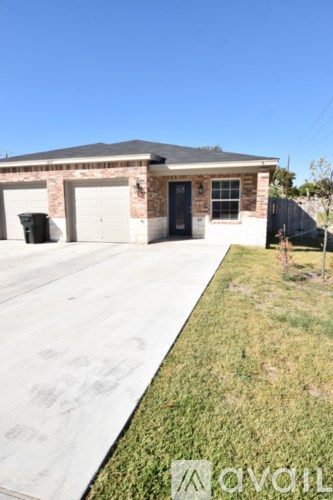 A house with a driveway in front of it.