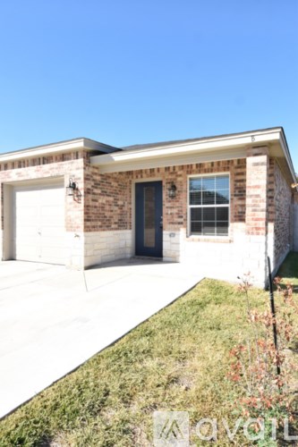A house with a garage and a driveway.