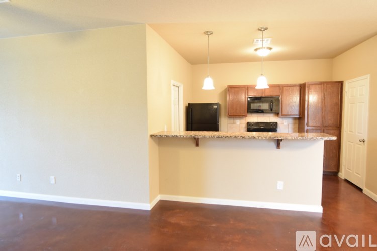 A kitchen with brown cabinets and a white counter.